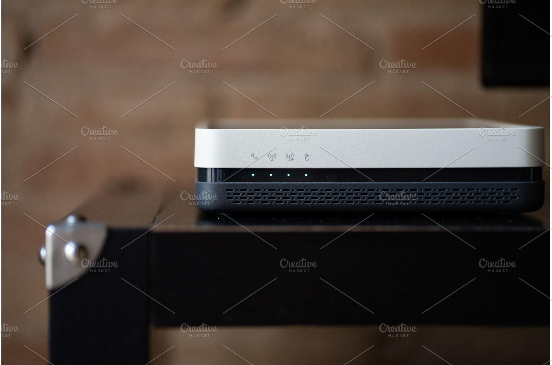 Modern Wi-Fi router sitting on a, a Technology Photo by volodymyrshtun13795
