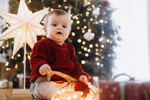 Merry Christmas and Happy Holidays! Cute baby in knitted sweater, a Holiday Photo by Sonjachni