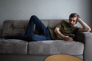 Young man relaxing on a comfortable