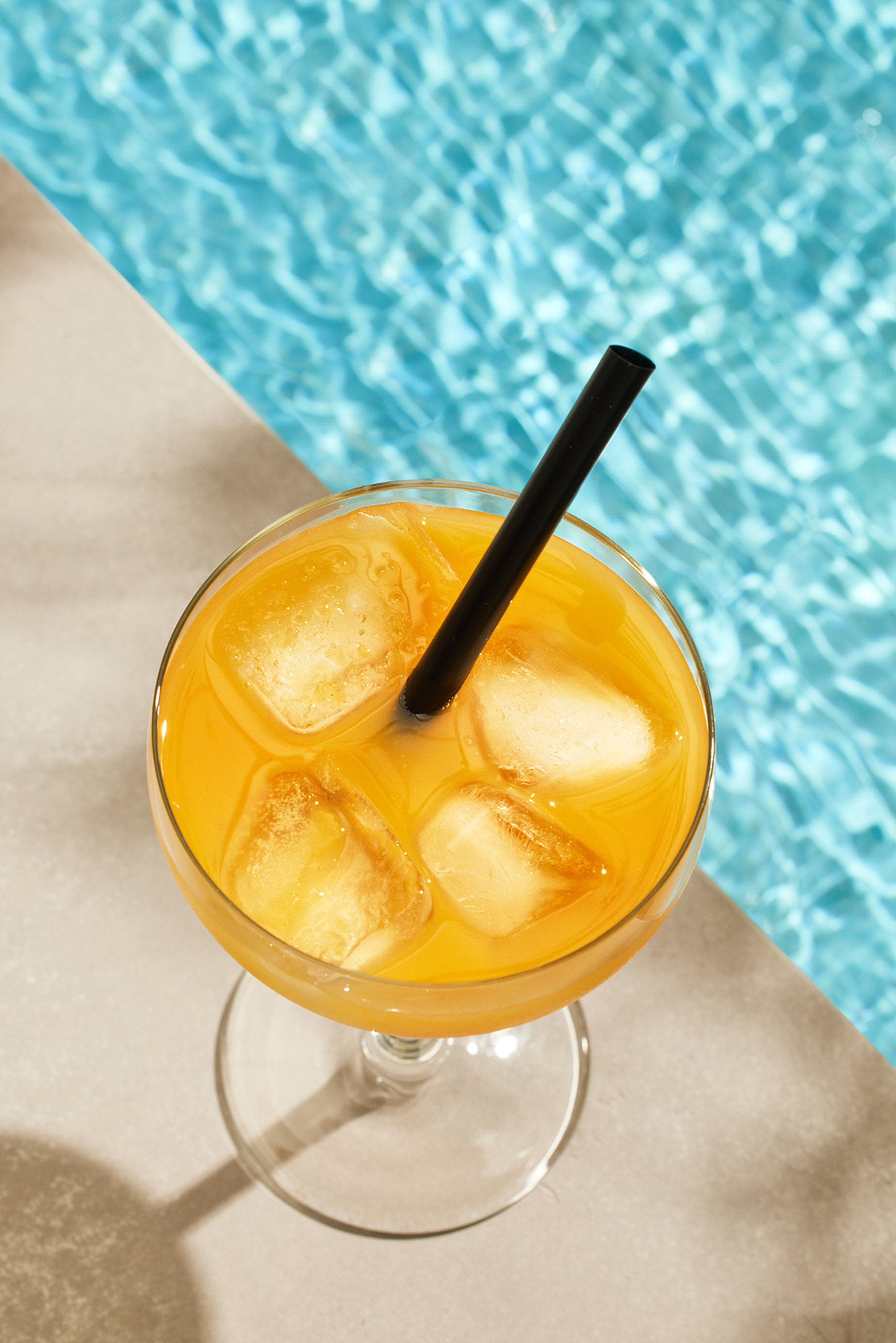glass of iced orange drink, a Food & Drink Photo by zeStudioPhoto