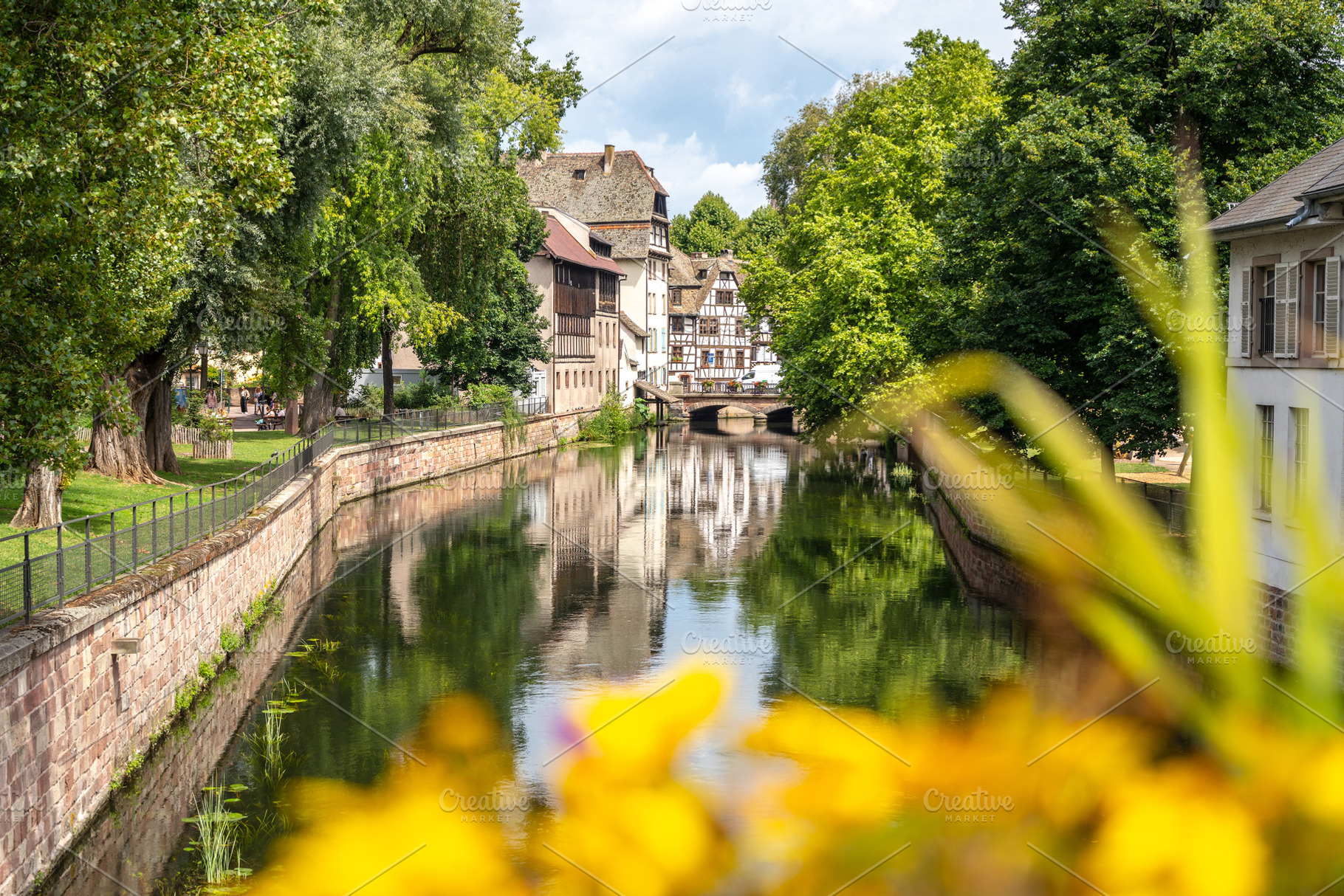 Flowers and canal view in Petite France Strasbourg, France, an Architecture Photo by GoodGoods