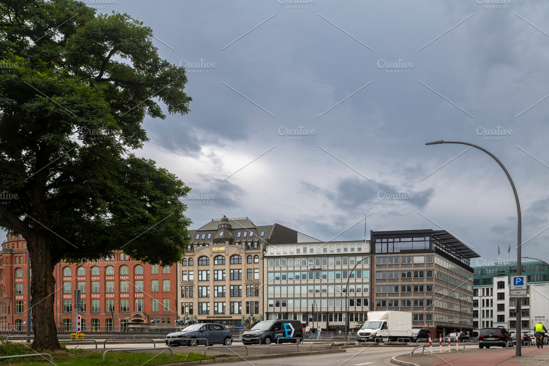 Hamburg, Germany, September 13, 2026 — View across a street wi, an Architecture Photo by Imaginarium
