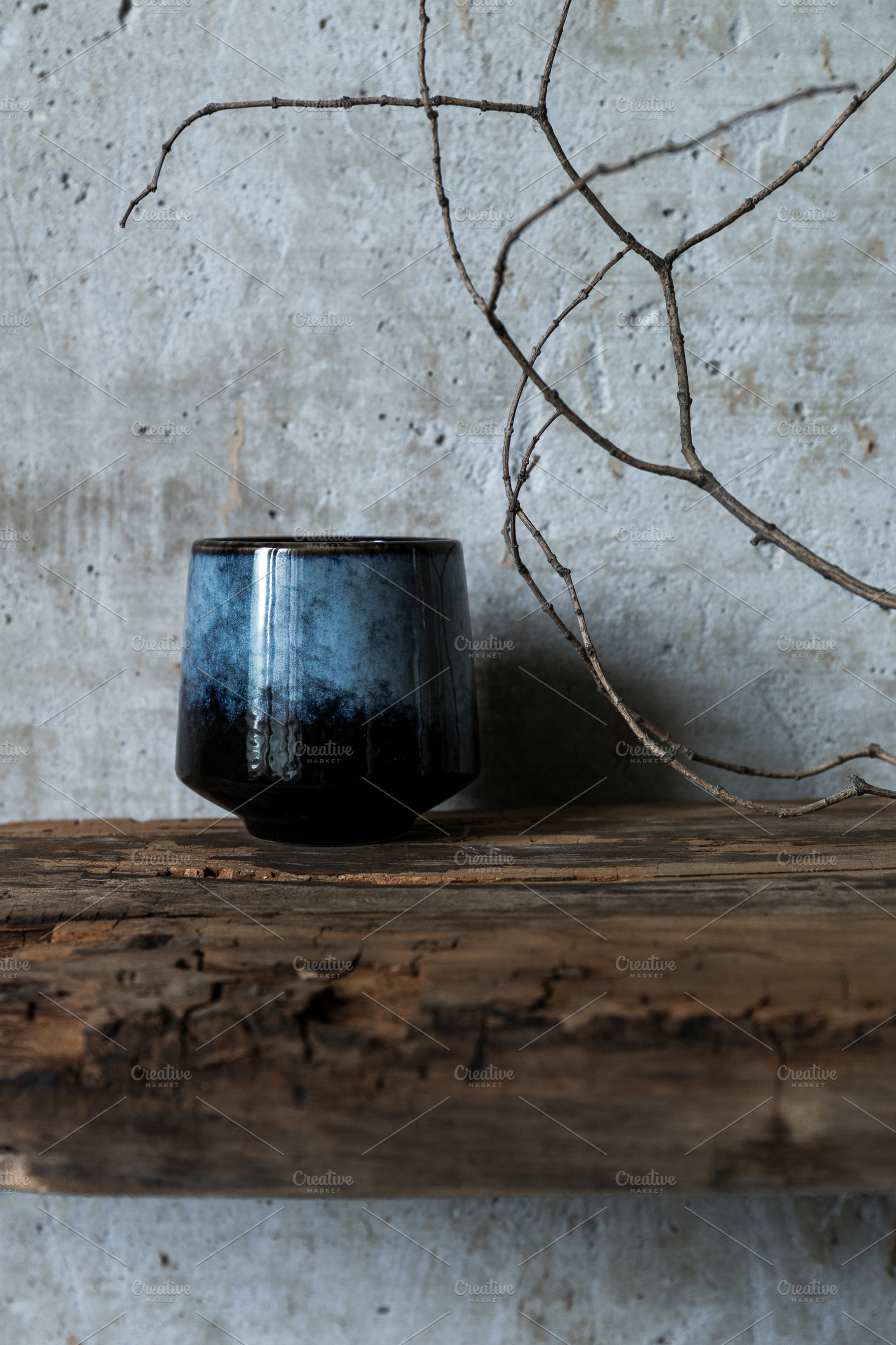 Dark ceramic cup on rustic wood with, an Arts & Entertainment Photo by Edalin's Store