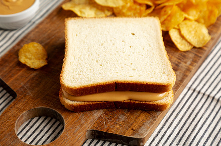 Homemade American Peanut Butter Sandwich on a Wooden Board, side