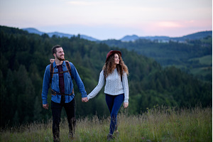 Travellers couple hiking on trail in, a Person Photo by HalfPoint