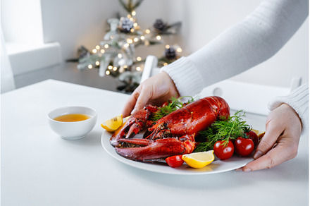 Delicious prepared red lobster on, a Food & Drink Photo by Yummypic