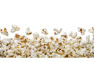 Popcorn scattered on a white, a Food & Drink Photo by innakreativ