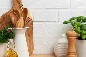Kitchen utensils, basil plant and spices creating cozy atmospher, a Food & Drink Photo by Olena Rudo
