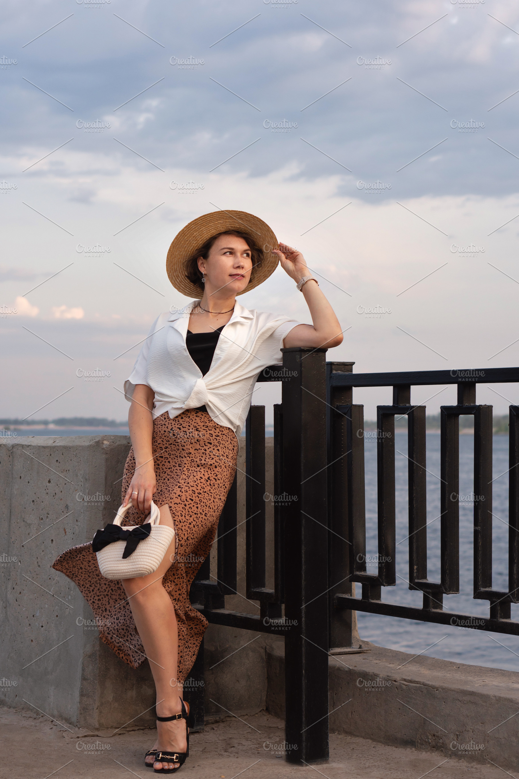 Stylish woman in straw hat, a Person Photo by Elena Vagengeim