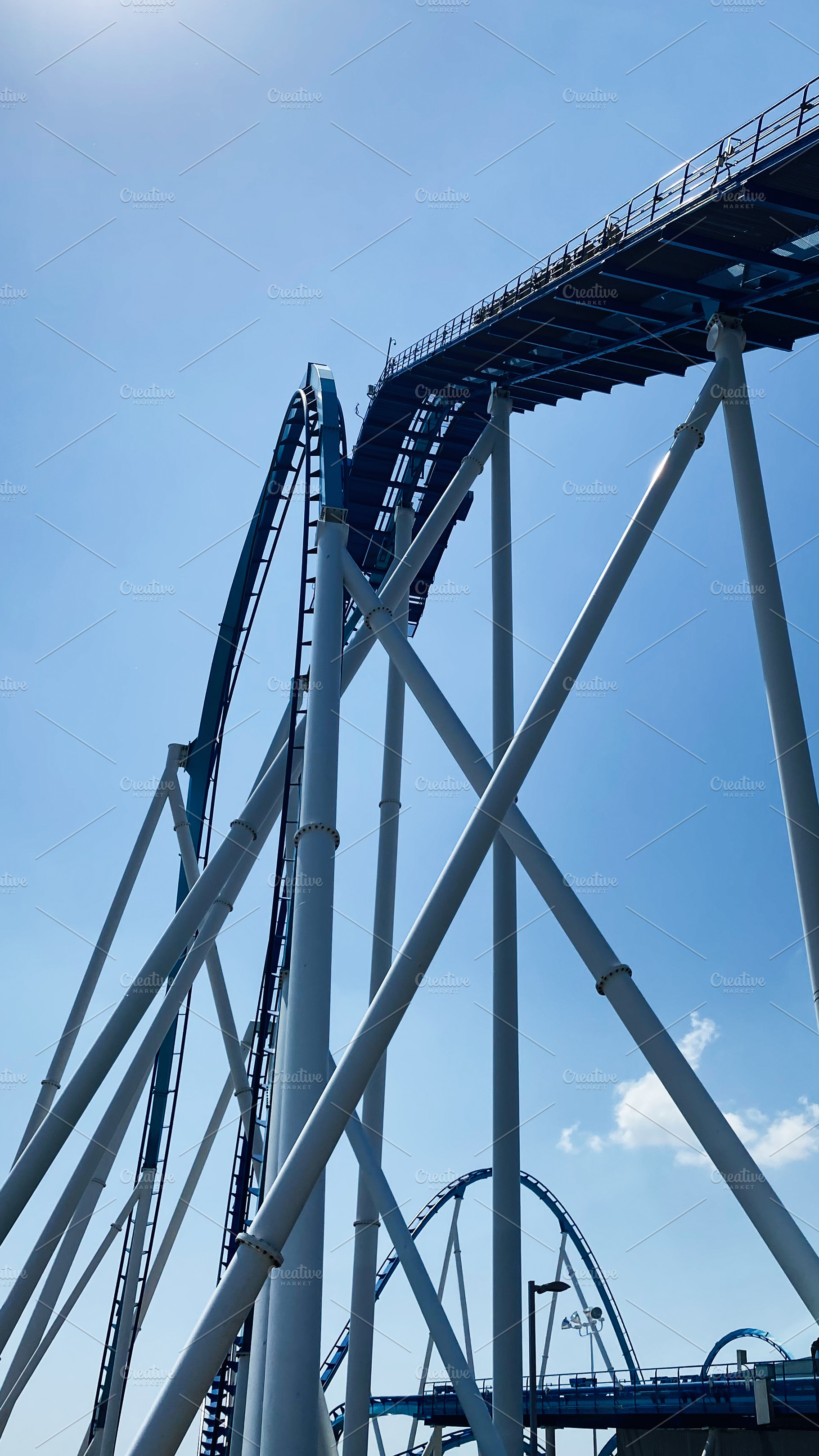 Blue roller coaster twists and climbs at Cedar Point , Ohio amusement park in b, a Photo by AS photostudio