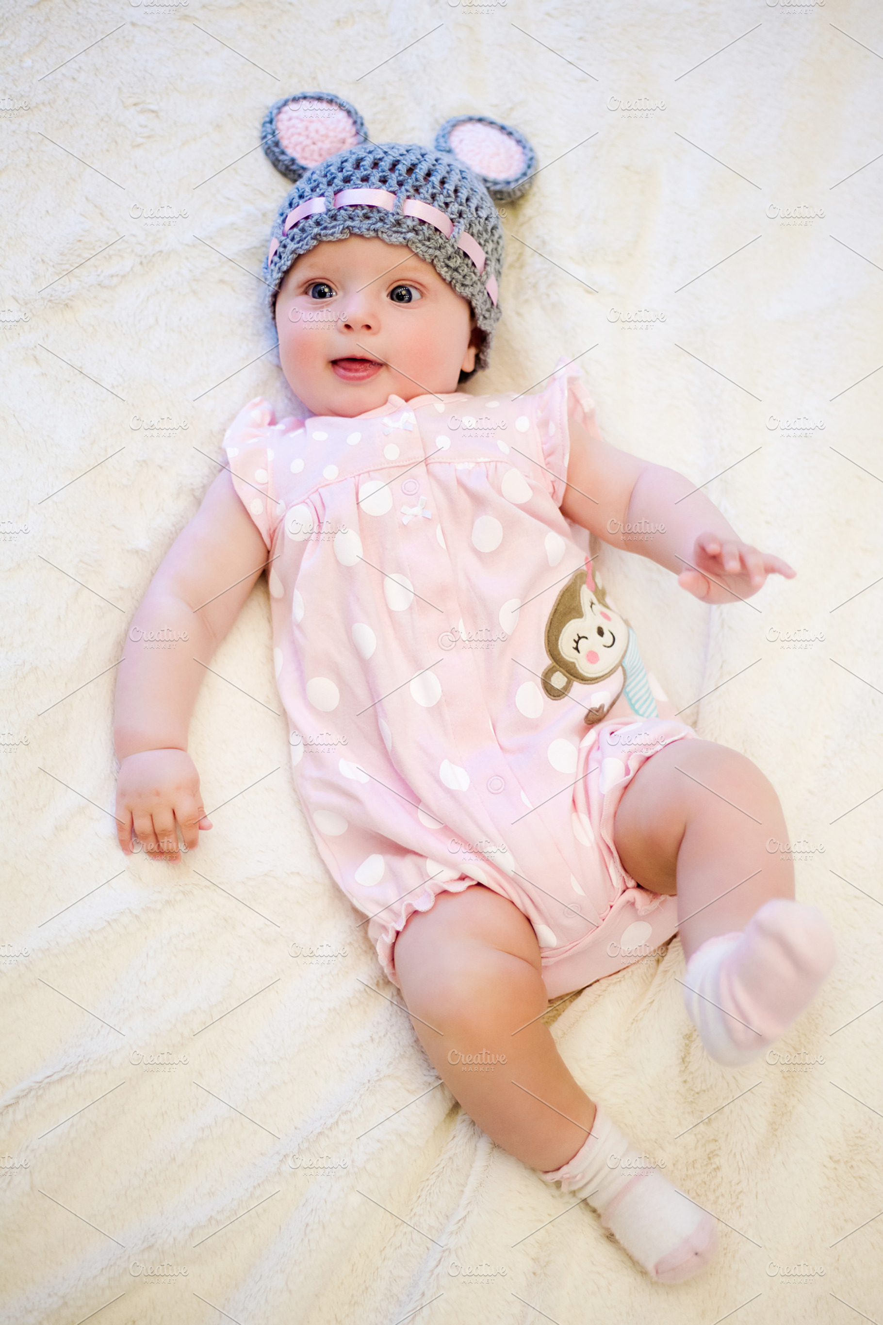 Baby girl lying on her back containing adorable, baby, and beautiful, a Person Photo by SaulichPhoto