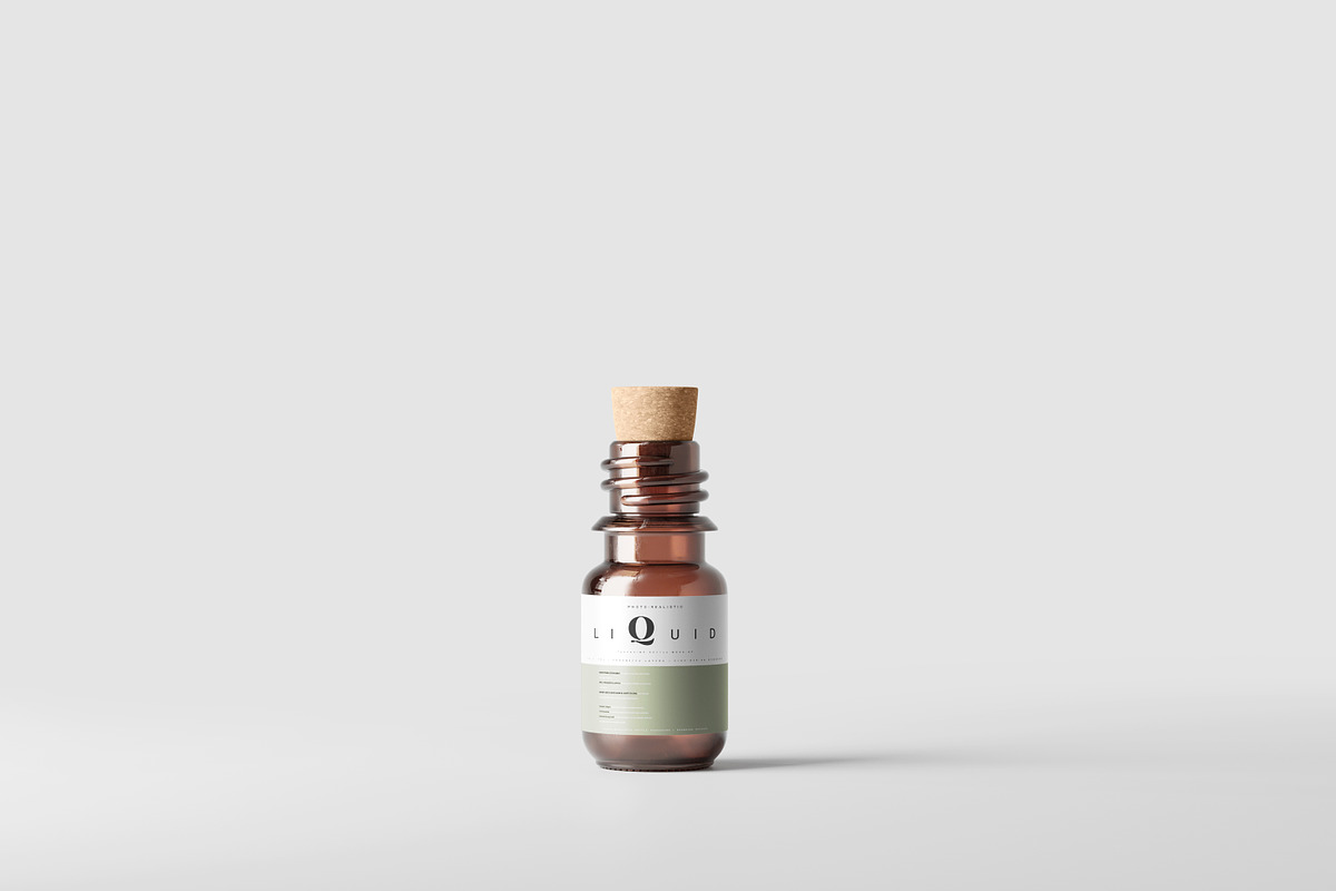 Amber Glass Bottle With Cork Mockup, a Cups & Container Mockup by pmvch (Photo 1 of 10)