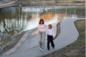 A mother and daughter are walking, a Person Photo by Nenahliadava Design