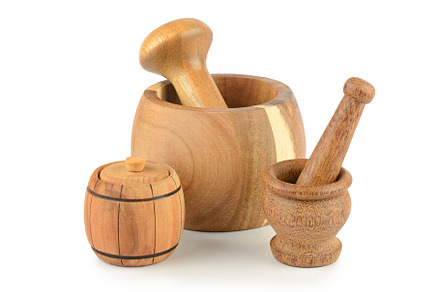 Beautiful wooden mortar and pestle isolated on white