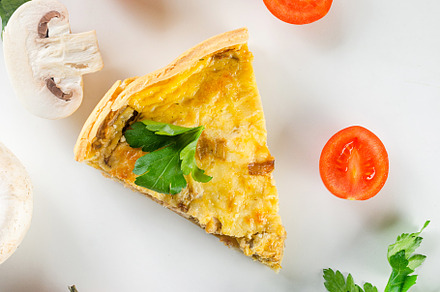 quiche Lorraine with chicken, mushrooms on the table, a Food & Drink Photo by vimart