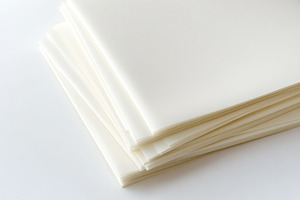 Stack of blank white paper sheets ar, a Background Photo by Pixeness Studio