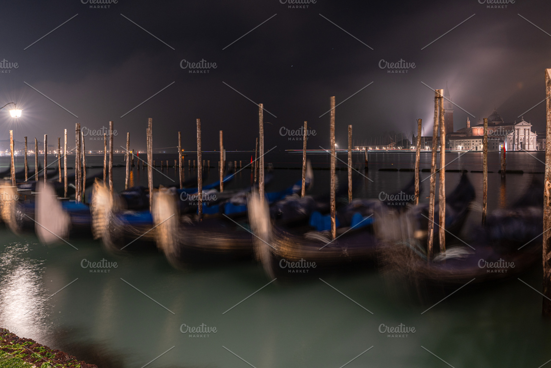 Gondolas along the pavementa and pier of San Marco in Venice, an Architecture Photo by Anna Bogush