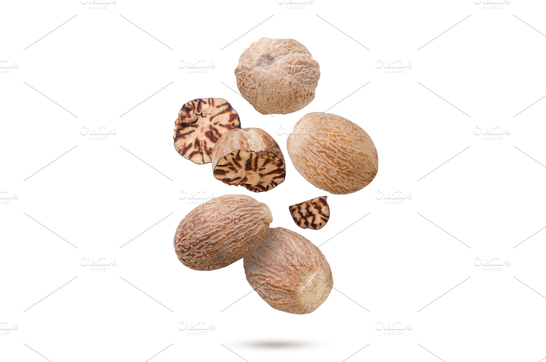 Nutmeg and broken pieces flying on a, a Food & Drink Photo by innakreativ
