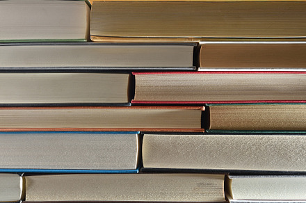 Detail of a stack of books showing the front edge, a School & Education Photo by Davizro's Market