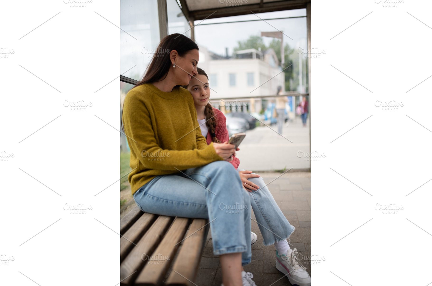 Woman and teenage girl waiting at, a Person Photo by HalfPoint