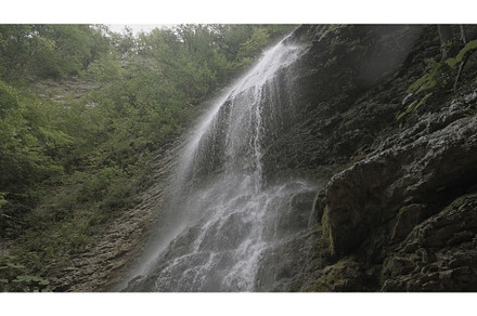 View from below of waterfall flowing, a Nature Photo by Media Whale Stock