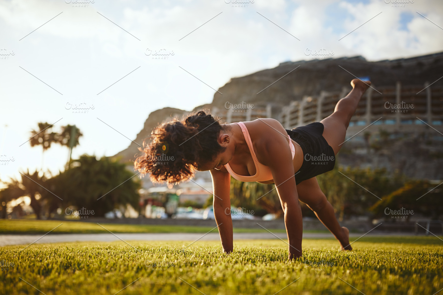 Fit woman in sportswear doing yoga alone in a park, a Sports & Recreation Photo by Stefan & Janni