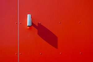Outdoor lamp with shadow on red wall, an Architecture Photo by BOOCYS