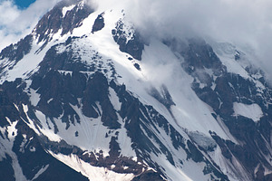 Vertical view of high Mount Kazbek peak with storm clouds and sn, a Photo by Pictures for you!!!!!!!!!