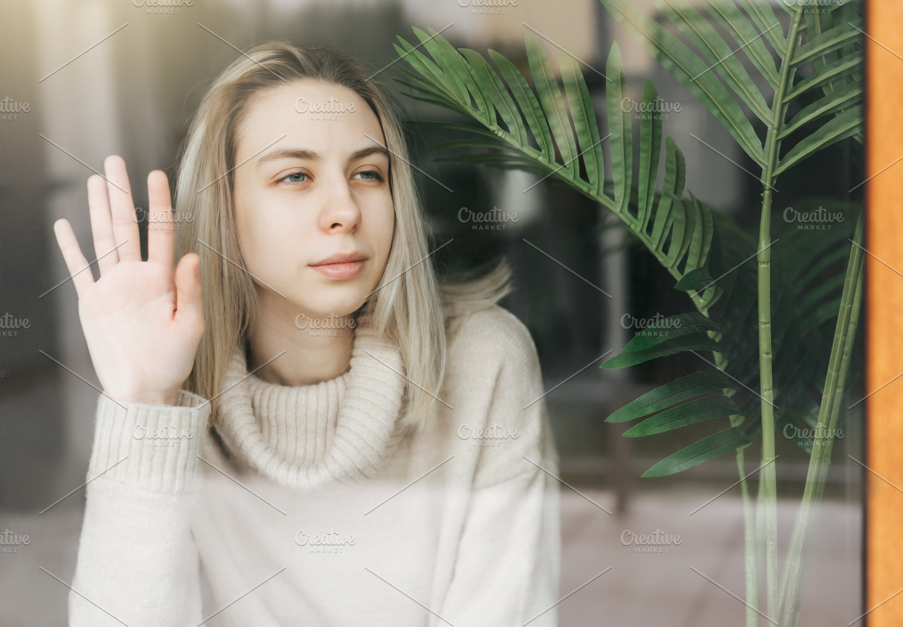 Sad girl near window thinking about something, a Person Photo by Olena Rudo