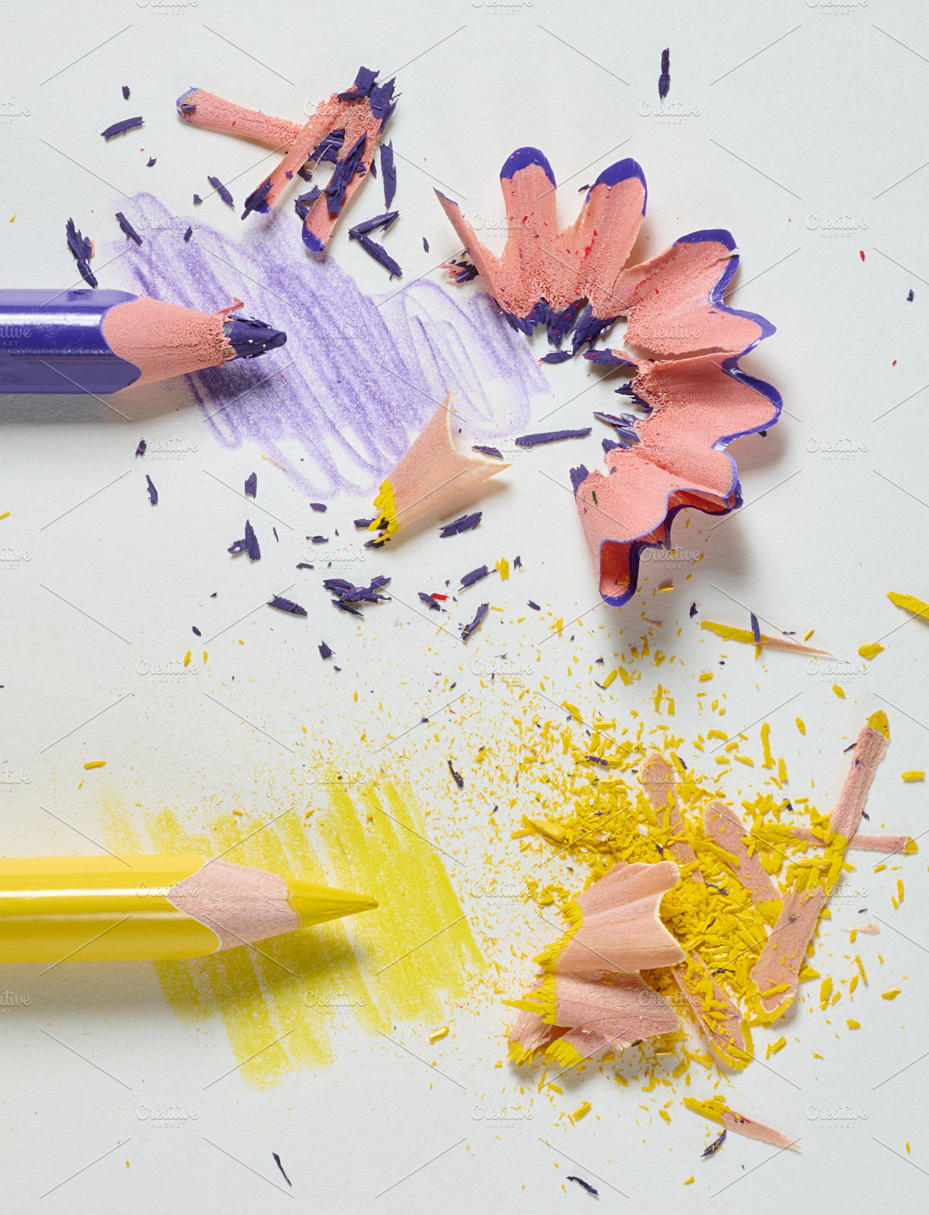 Purple and yellow pencils with colored shavings and drawn stroke, a School & Education Photo by ndanko