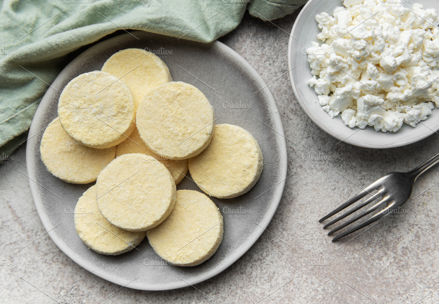 Frozen cottage cheese pancakes ready for cooking, a Food & Drink Photo by Olena Rudo