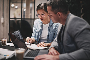 Two businesspeople sitting at a tabl