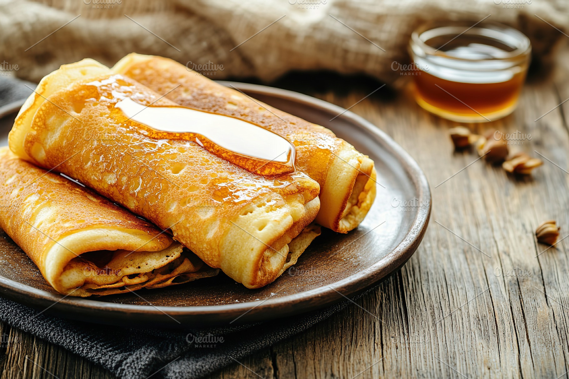 Delicious pancakes topped with sweet syrup on a rustic wooden table, a Food & Drink Photo by AlyaAnd
