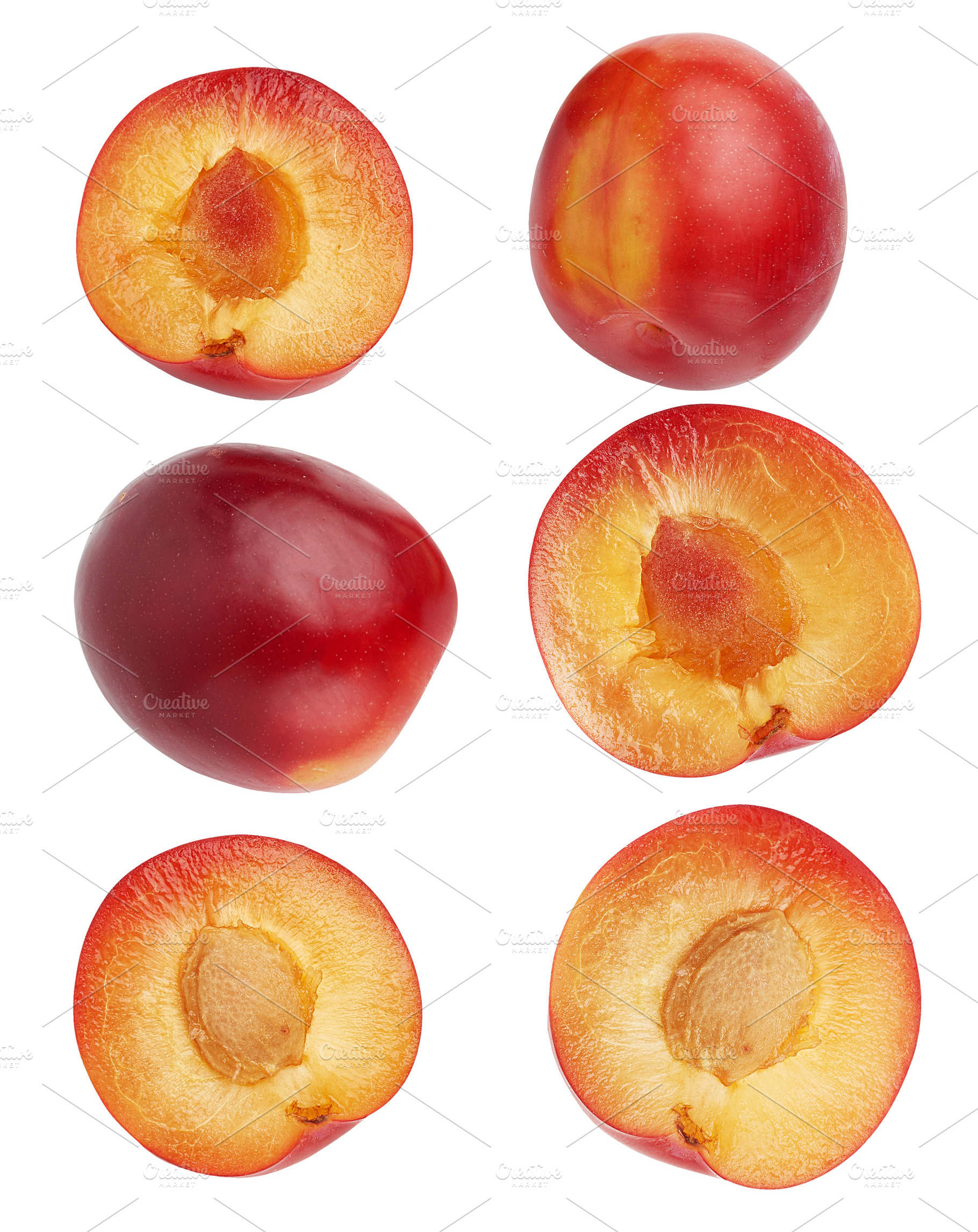 Red whole and halves of plum, isolated background, a Food & Drink Photo by ndanko