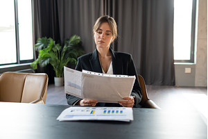 Businesswoman in a formal black suit, a Business Photo by undrey
