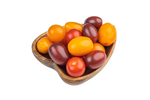 Colorful mix of heirloom cherry tomatoes in a wooden bowl shot o, a Food & Drink Photo by composter-box@mail.ru