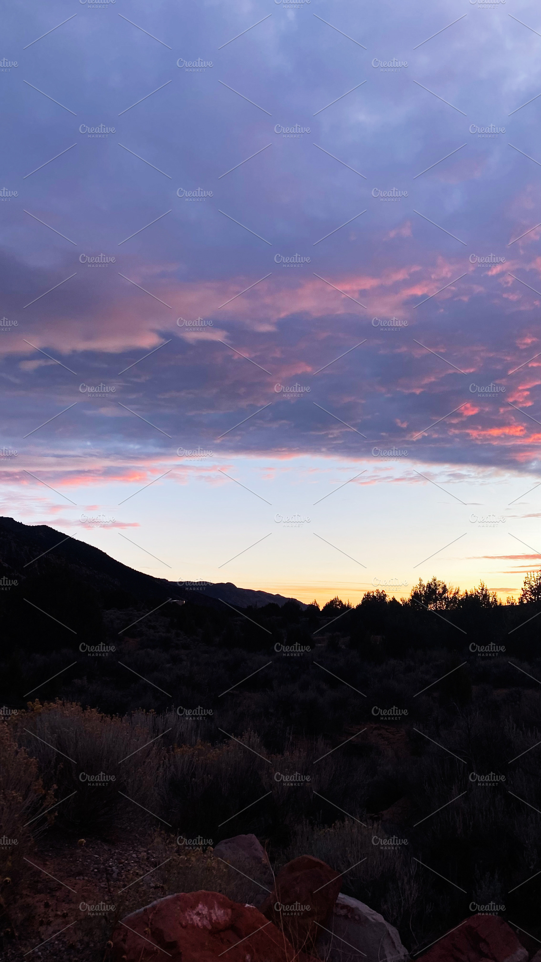Sunset over Utah desert hills with purple clouds and silhouettes at dusk, a Nature Photo by AS photostudio