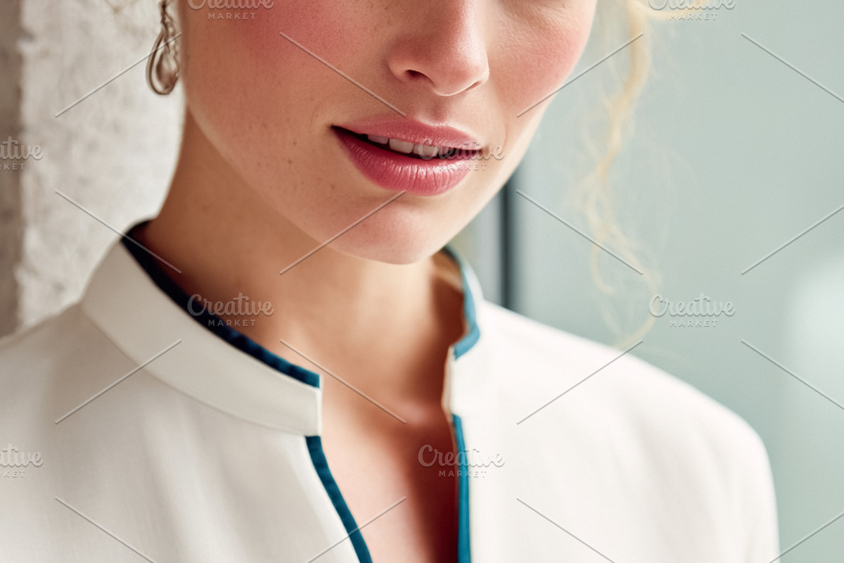 Blonde woman wearing elegant white blouse with teal trim, natura, a Beauty & Fashion Photo by Studio ANNA (Photo 2 of 2)