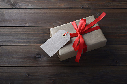 gift box with red ribbon, a Background Photo by Mamuka Gotsiridze