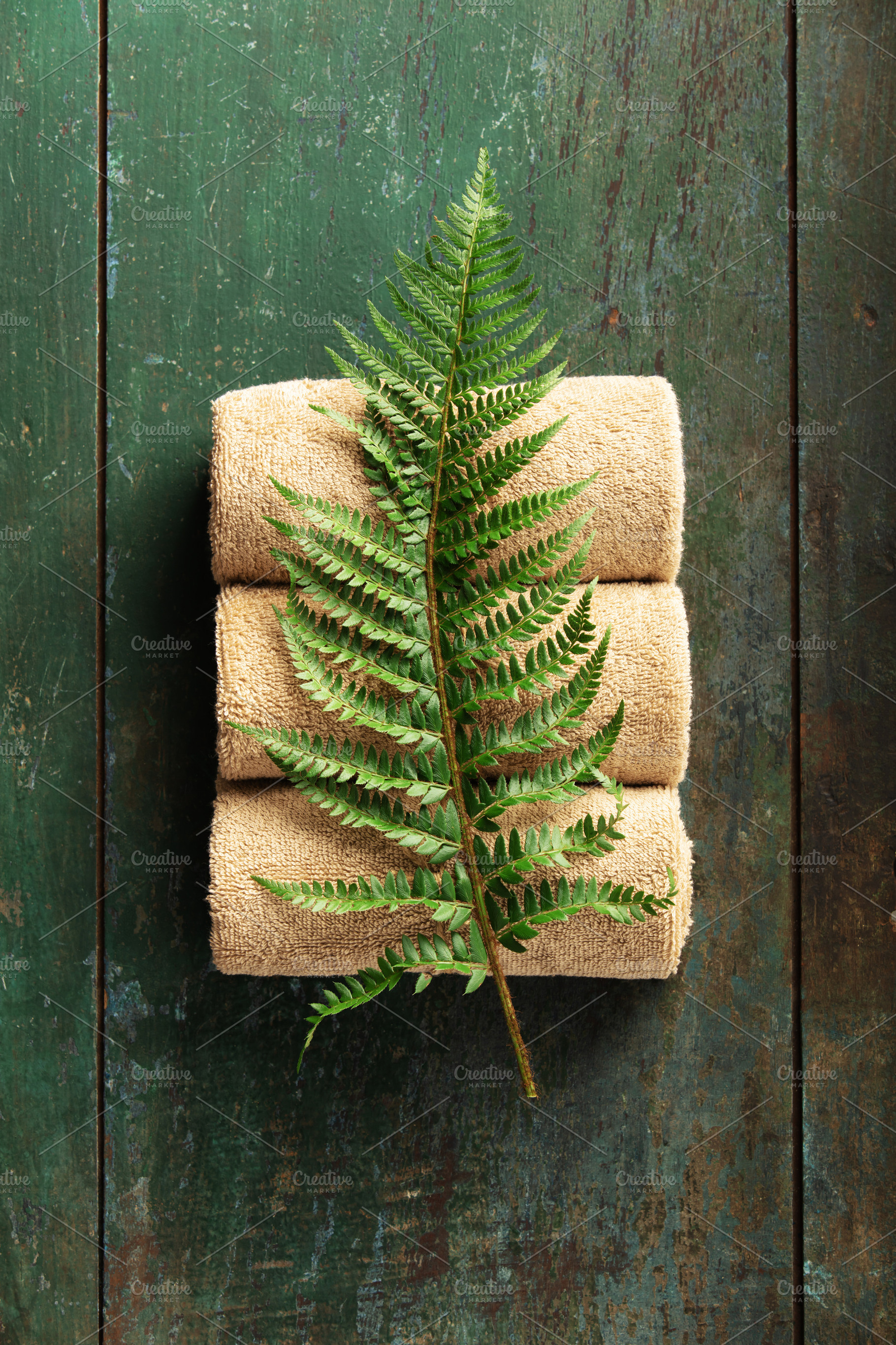 Natural Spa Towels with Green Fern Leaf on Rustic Wooden Backgro, a Beauty & Fashion Photo by Natalia Klenova's Shop