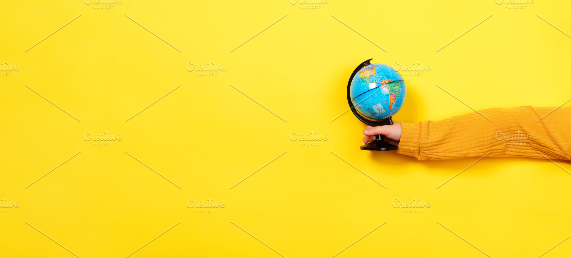 Hand Holding Small Globe, a School & Education Photo by Ales Munt