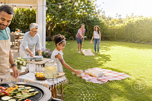 Family enjoying summer backyard barb, a Photo by Dvoevnore photos