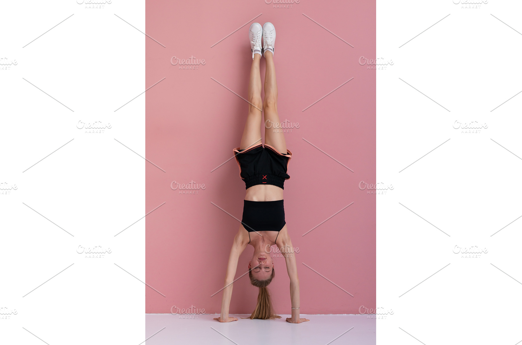 Young woman performing a handstand, a Sports & Recreation Photo by undrey