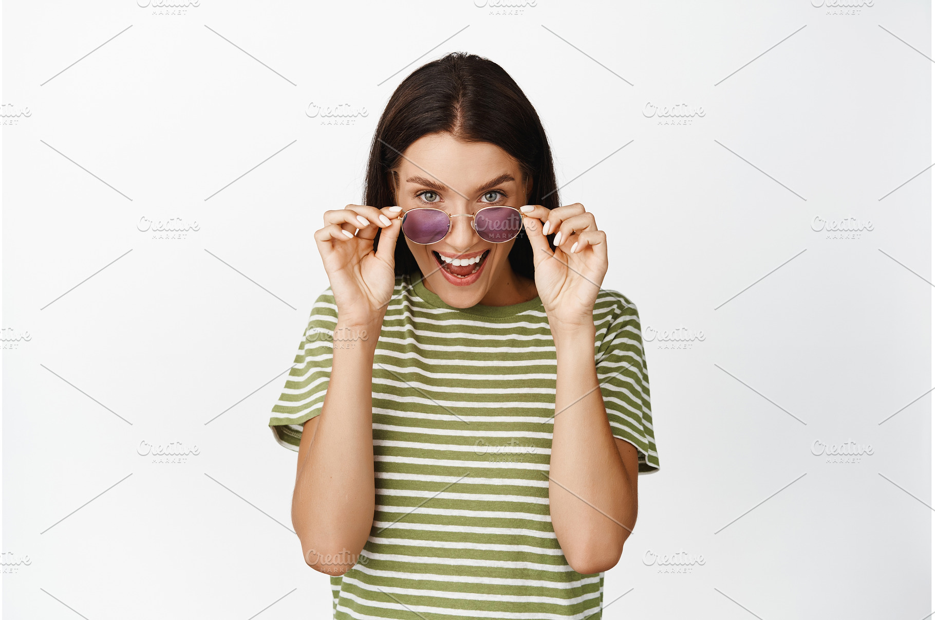 Excited girl taking off sunglasses, a Person Photo by Cookie Studio