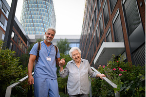 Caring healthcare worker helping, a Health & Medical Photo by HalfPoint