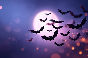 Bats flying under a full moon during twilight hours in a clear sky, a Holiday Photo by AlyaAnd