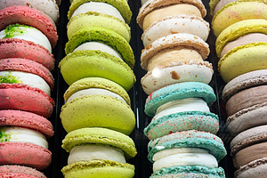 Colorful macarons displayed in a shop showcasing their vibrant assortment and f, a Photo by AS photostudio