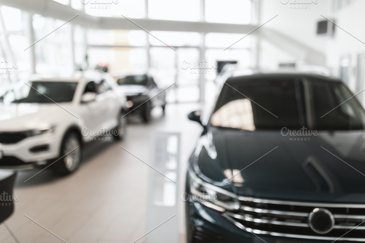 Blurred dealership store interior with modern new cars, free space. Vehicle pur, a Photo by Prostock-Studio (Photo 1 of 2)