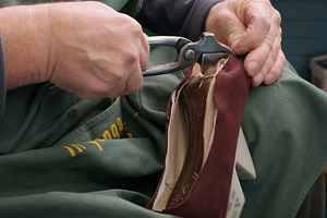Fixing footwear professional shoemaker handmade, a Person Photo by Photo Drive Studio