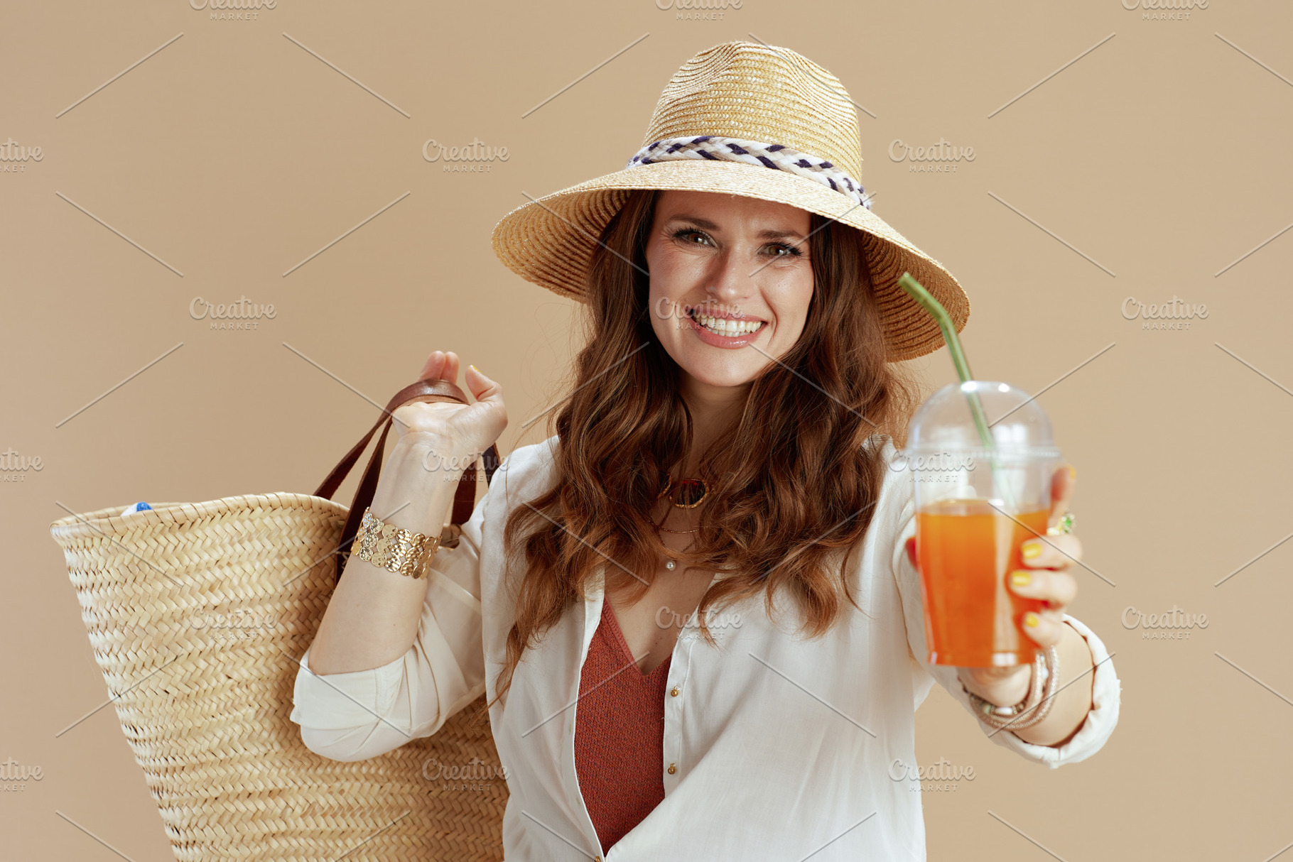smiling 40 years old housewife in blouse and shorts on beige, a Person Photo by Alliance Images